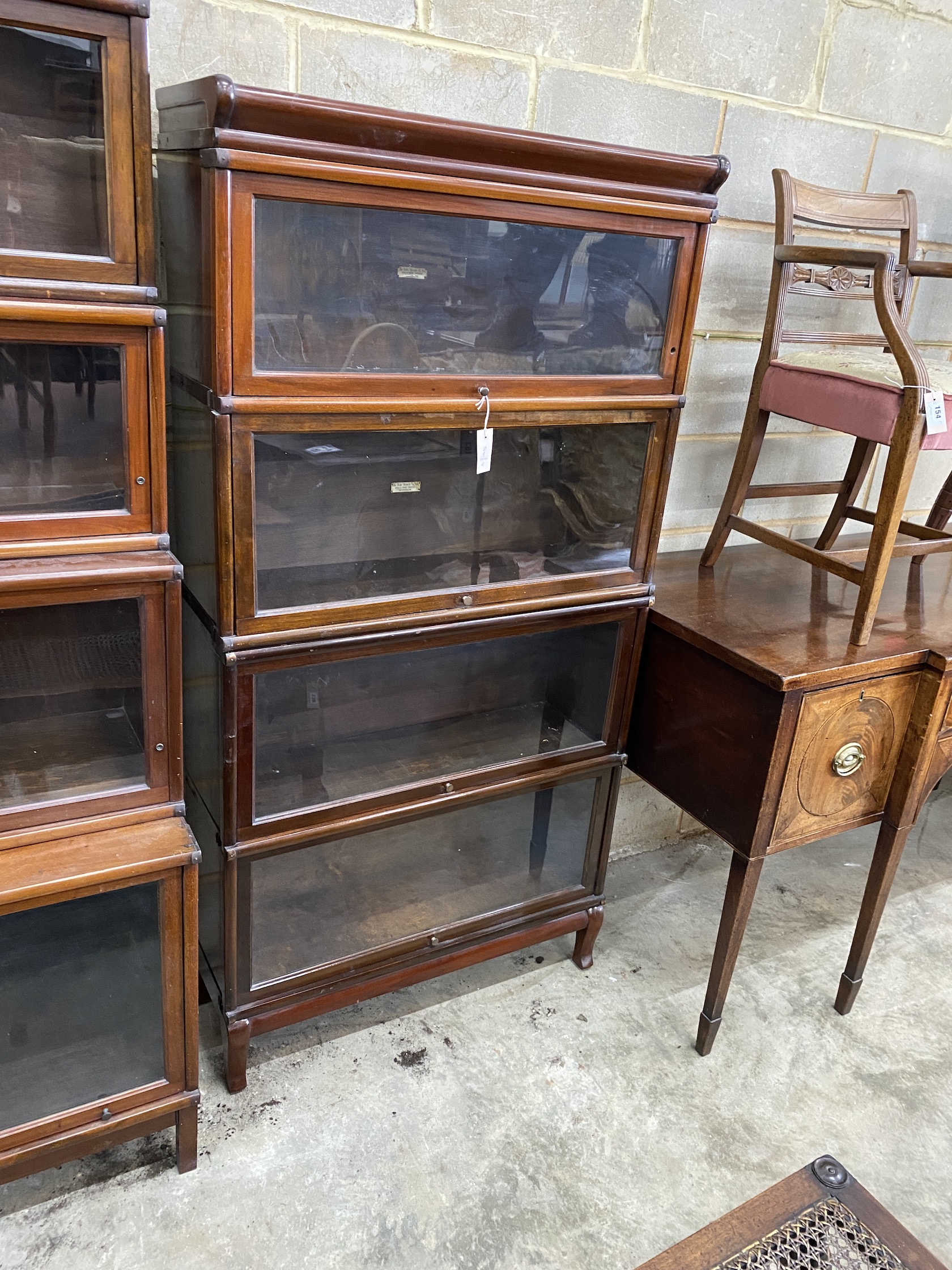 A Globe Wernicke mahogany four section bookcase, width 86cm, depth 29cm, height 172cm